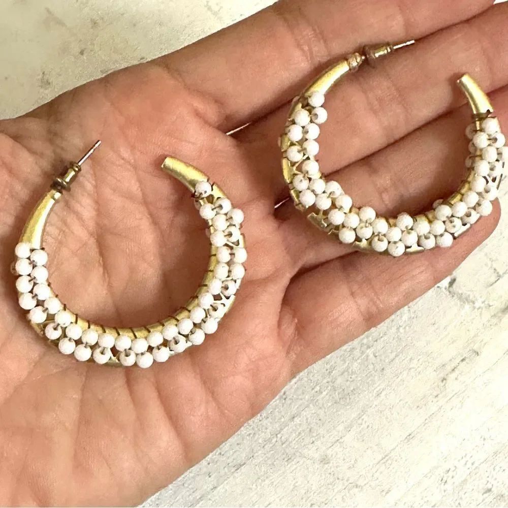 Gold tone white beaded hoop earrings